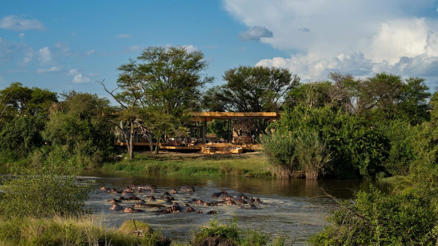Tanzania - Grumeti Serengeti River Lodge - Guest Area exterior with hippo pod 2