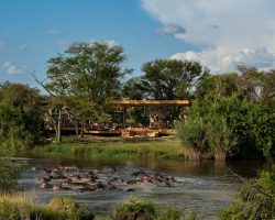 Tanzania - Grumeti Serengeti River Lodge - Guest Area exterior with hippo pod 2